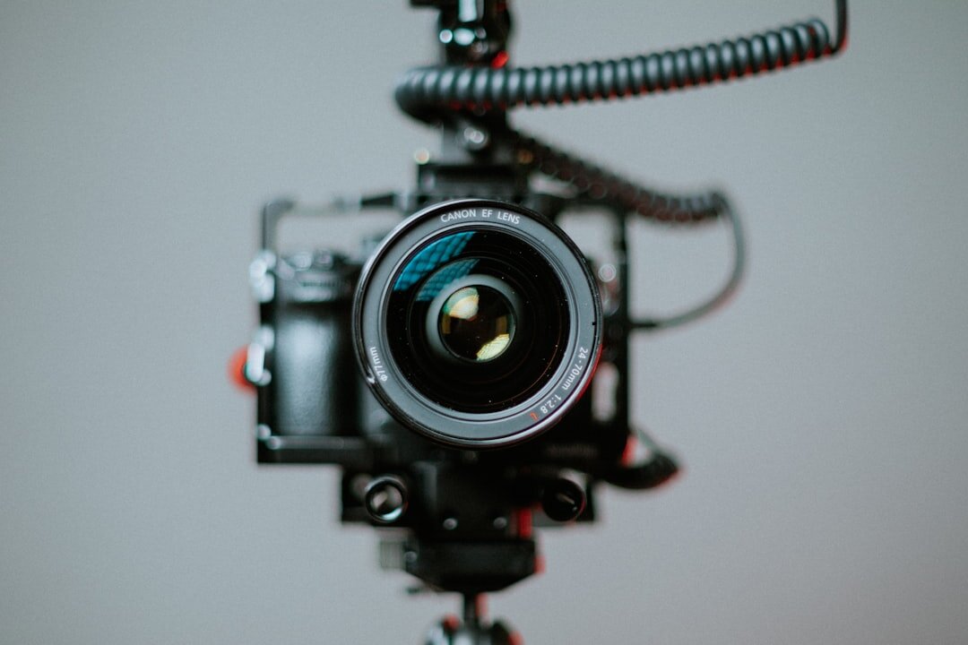 Student learning professional video camera operation in a broadcast training environment