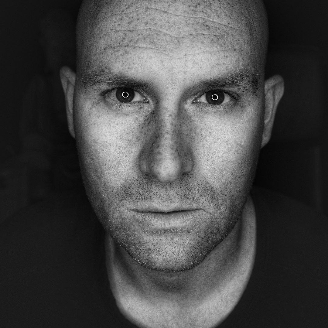 Professional headshot of a male broadcast training director