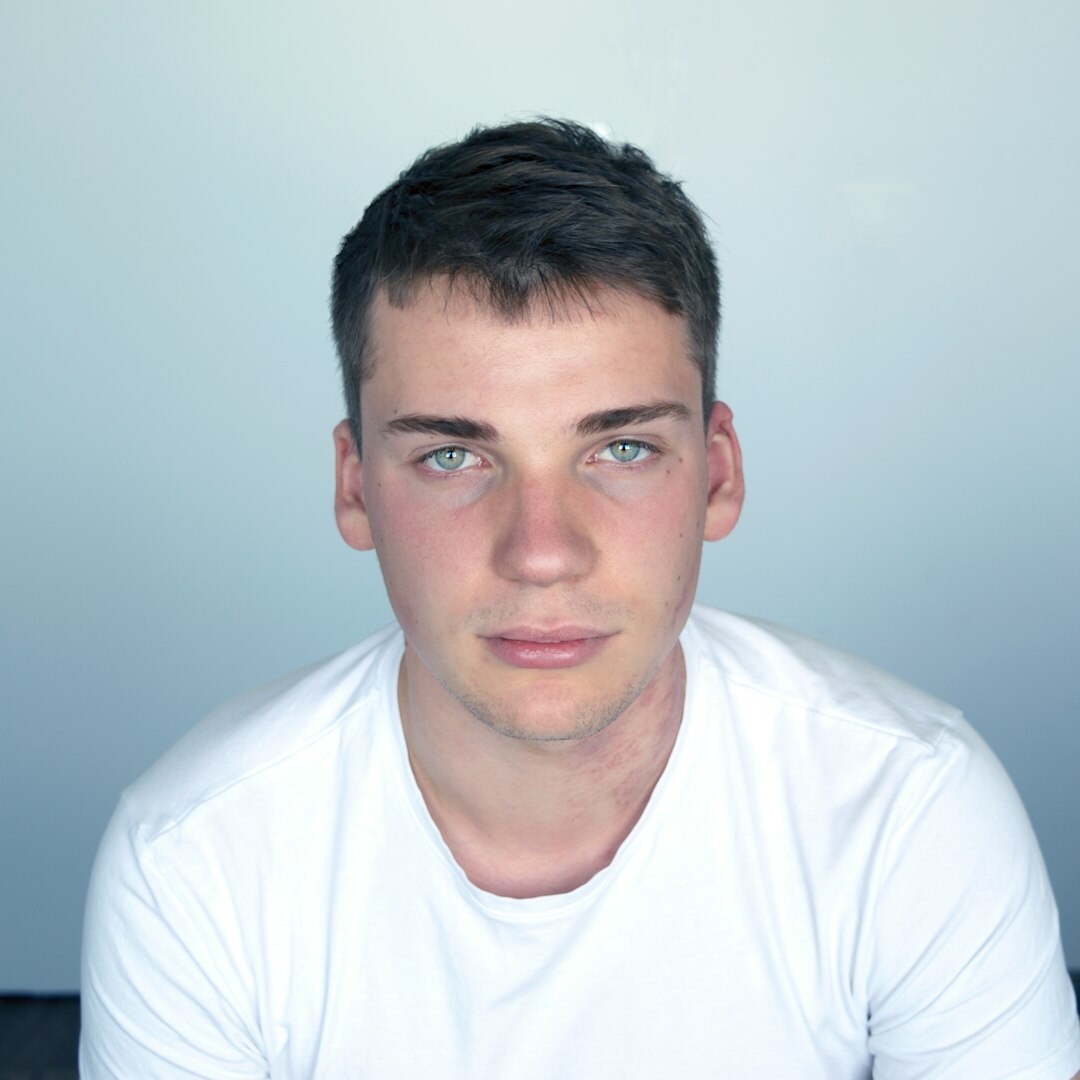 Professional headshot of a male live broadcast specialist and trainer