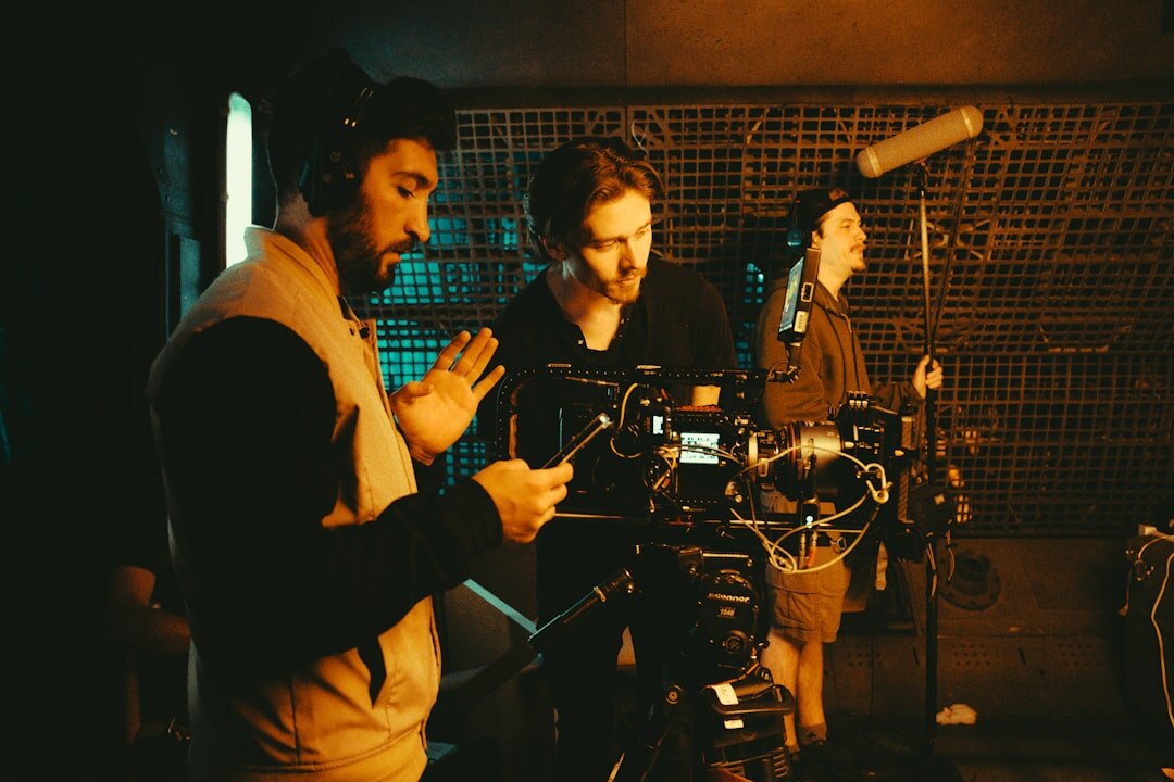 Group of media professionals collaborating in a modern video production studio