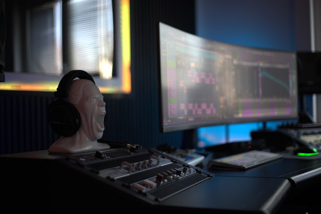 Media professional managing live signal routing on a broadcast mixing board