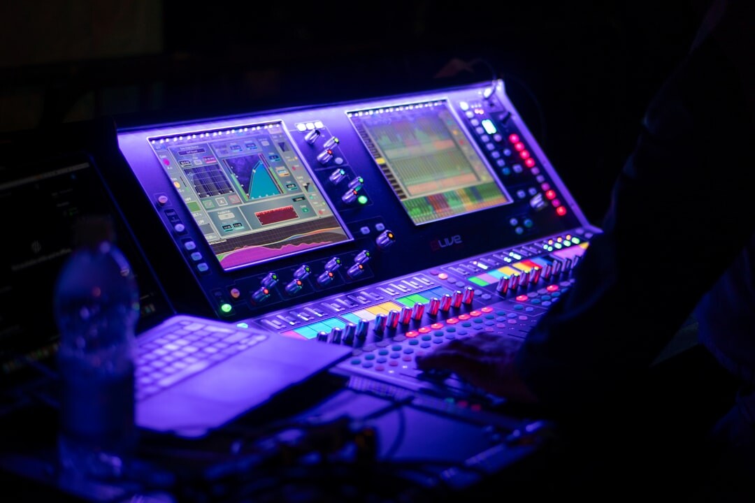 Video engineer operating professional broadcast equipment at a production desk