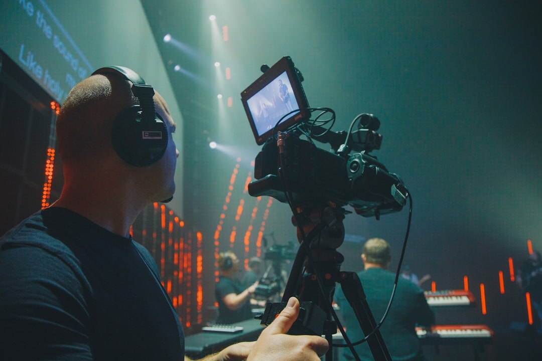 Professional news broadcast presenter on a modern television studio set